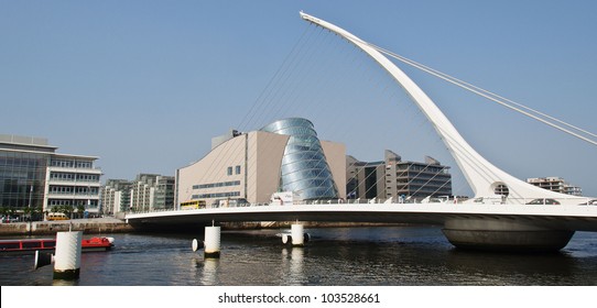 Dublin city skyline cityscape Ireland. The Samuel Beckett Bridge crosses the Liffey River in Dublin. The Convention Centre Dublin in the Dublin Docklands Ireland. Dublin city landmark.