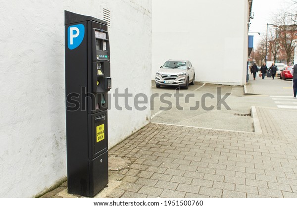 Dublin, Ireland - 04.01.2021:\
Modern parking pay station on a street allow parkers pay by card or\
cash