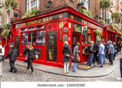 DUBLIN, IRELAND - 05 MAY, 2016: Tourists walking in the Temple Bar area. The place is the cultural quarter in the center of the city and is full of restaurants, bars and nightclubs.