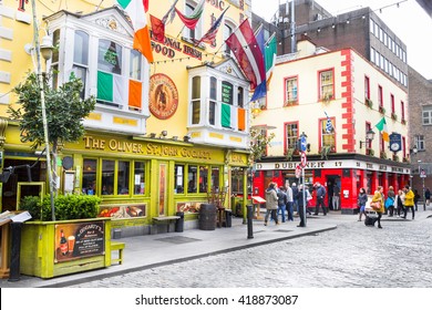 DUBLIN, IRELAND - 05 MAY, 2016: Tourists walking in the Temple Bar area. The place is the cultural quarter in the center of the city and is full of restaurants, bars and nightclubs.