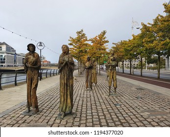 Dublin, Ireland - 16 SEPTEMBER 2018 : Bronze Sculptures Of Irish Famine By River Liffey In Docklands, Custom Quay In Commemorate The Great Hunger Period. 