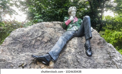 DUBLIN - IRELAND: 25 JUNE, 2017: Oscar Wilde monument in Merrion Square Park. The famous statue of the Irish poet and playwright was made by Danny Osborne.
