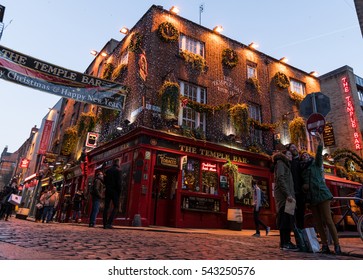 Dublin, Ireland - 26th Dec 2016: Temple Bar historic district., Dublin, Ireland, Christmas decoration at The Temple Bar Pub. Tourists taking selfie