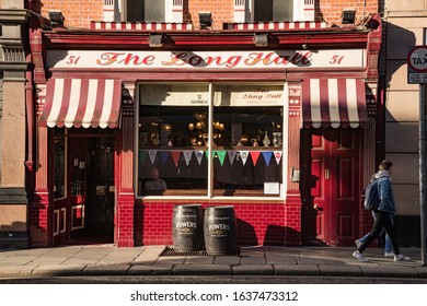 Dublin, Ireland - 29th January 2020: Walking By The Long Hall Pub In South Great Georges Street, One Of Dublins Oldest Pubs Dating Its History Back To 1766.