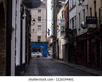 Dublin, Ireland - April 17th 2016: Cobbled Street In Shadow, Temple Bar, Dublin.