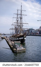 DUBLIN, IRELAND - APRIL 23, 2022: Vertical Shot Of The Jeanie Johnston Famous Tall Ship Moored On The River Liffey In Dublin. She Serves As The Irish Famine Ship Museum With Guided Tours.