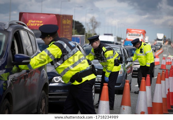 Dublin, Ireland - April 29, 2020: a\
checkpoint on the N7 motorway. Gardaí have set up checkpoints\
across the country in a bid to limit people breaking the\
Government\'s Covid-19 travel\
restrictions.
