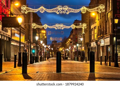 Dublin, Ireland - December 19, 2020: Christmas Lights On Empty Henry Street In The Early Morning During The COVID-19 Lockdown