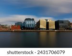 Dublin, Ireland, Dockland, modern building business center cityscape by Liffey river view during sunny day in background. europe