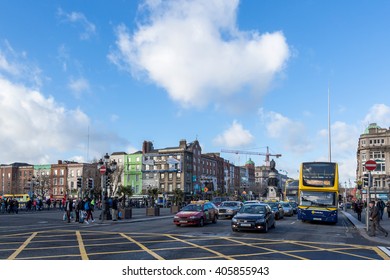 Dublin, Ireland - February 15th 2015 - Cars waiting in the red traffic light, buildings in the background in a blue sky day in Dublin, Ireland.