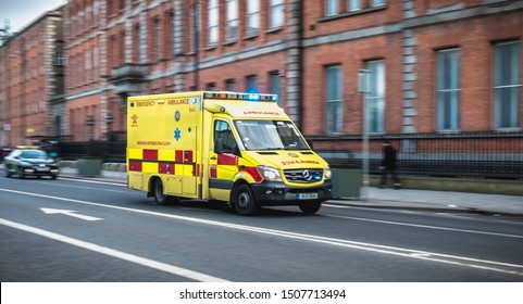 Dublin, Ireland - February 16, 2019: Irish Ambulance Driving Fast On The Streets Of Dublin On A Winter Day