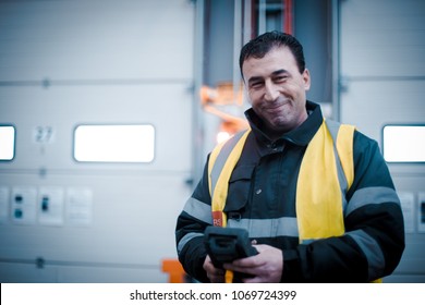 Dublin, Ireland - February 27th 2018: Happy Worker In Hi Vis Jacket On Factory Floor