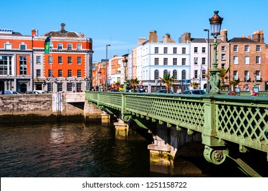 Dublin, Ireland. Grattan Bridge at day in Dublin, Ireland. Beautiful architecture. Car traffic, clear blue sky