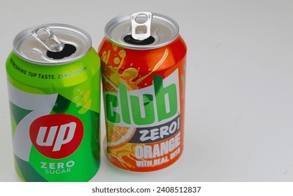 Dublin, Ireland - January 3rd 2024: A  close up photo of seven up and club zero soda fizzy drink cans on a white surface. 