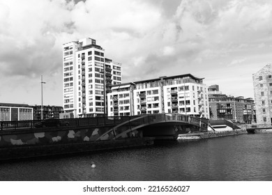 DUBLIN, IRELAND - May 19, 2022: A Grayscale Of The City Bridge And Modern Buildings In Grand Canal Dock, Dublin