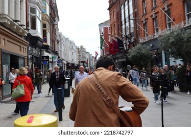 DUBLIN, IRELAND - May 19, 2022: A Busker Performing On Grafton Street Dublin