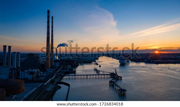 Dublin / Ireland - May 2020  : Aerial view of\
Dublin Waste to Energy - Covanta incineration plant, The Great\
South Wall and Poolbeg\
chimneys,