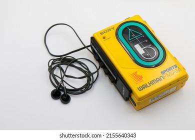 Dublin, Ireland - May 2022: Sony Sports Walkman Radio Cassette Player. Retro Vintage Portable Audio Music Device 1980s. Earphones Or In-ear Headphones Attached.