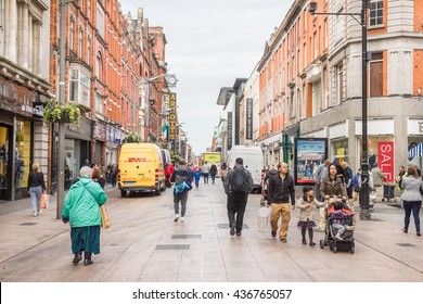 DUBLIN, IRELAND - MAY 6, 2016: People walking in the Henry Street. The pedestrian street is famous for its artists, restaurants and more than 200 shops.