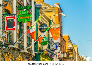 DUBLIN, IRELAND, MAY 9, 2017: Colourful shields on a busy street in the central Dublin, Ireland