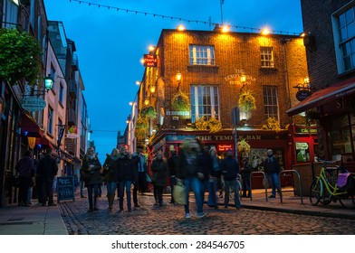 DUBLIN, IRELAND - NOVEMBER 11, 2014: Nightlife at popular historical part of the city - Temple Bar quarter. The area is the location of many bars, pubs and restaurants