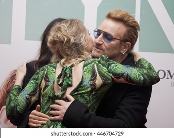 DUBLIN, IRELAND - OCTOBER 2015: Actress Saoirse Ronan greets Bono and Ali Hewson with a hug at the Irish premiere of her latest film, Brooklyn, at the Savoy Cinema.