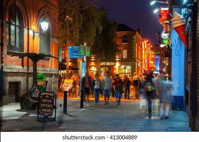 DUBLIN, IRELAND - SEPTEMBER 7, 2014: Nightlife at popular historical part of the city - Temple Bar quarter. The area is the location of many bars, pubs and restaurants