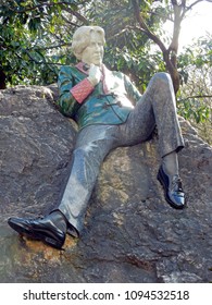 Dublin, Ireland-April 14, 2018: Sculpture of writer Oscar Wilde in Merrion Square. The artwork by Danny Osborne was unveiled in 1997. The art shows Wilde reclining on a large boulder. 