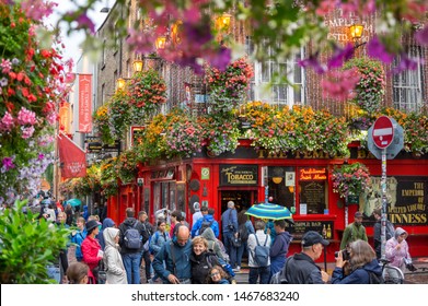 Dublin,Ireland - JULY 30, 2019: People Walking By Famous Irish Pub , THE  TEMPLE BAR 