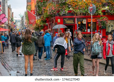 Dublin,Ireland - JULY 30, 2019: People Walking By Famous Irish Pub , THE TEMPLE BAR