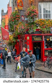 Dublin,Ireland - JULY 30, 2019: People Walking By Famous Irish Pub , THE TEMPLE BAR