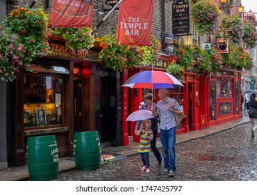 Dublin,Ireland - JULY 30, 2019: People Walking By Famous Irish Pub , THE TEMPLE BAR