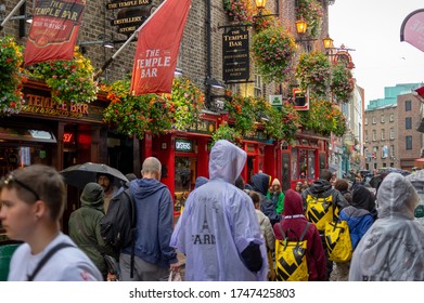 Dublin,Ireland - JULY 30, 2019: People Walking By Famous Irish Pub , THE TEMPLE BAR