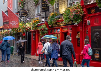 Dublin,Ireland - JULY 30, 2019: People Walking By Famous Irish Pub , THE TEMPLE BAR