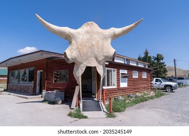 Dubois, Wyoming - August 8, 2021: Interesting Exterior Of The Laundromat And Car Wash, With A Cow Skull Bone In Doorway