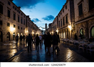 Dubrovnik, Croatia - December 31 2015: Stradun Old Street Decorated With Christmas Lights And Ornaments In The Night With Poeple Walking Around