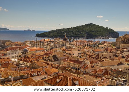 Dubrovnik old city streets, Red roofs and Lokrum island in background. Croatia 