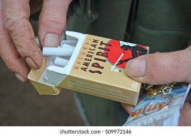 DUBUQUE, IOWA - MAY 10, 2016: A Vintage Natural American Spirit Cigarette Brown Box In An Old Man Hands.