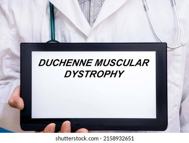 Duchenne Muscular Dystrophy.  Doctor With Rare Or Orphan Disease Text On Tablet Screen Duchenne Muscular Dystrophy