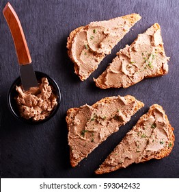 Duck Liver Pate Over Brown Bread On Board