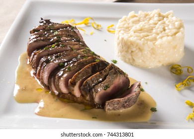 Duck Magret With Tucupi Sauce And Jambu Risotto.