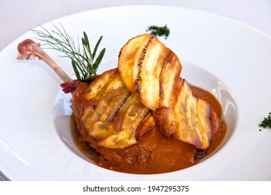 Duck Meat Dish Covered With Mole Colorado And Fried Plantain, Close Up View