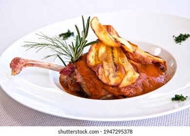 Duck Meat Dish Covered With Mole Colorado And Fried Plantain, Close Up View