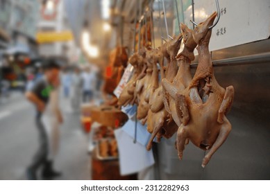 Ducks hanging on a hook and display on a market in Hong Kong 