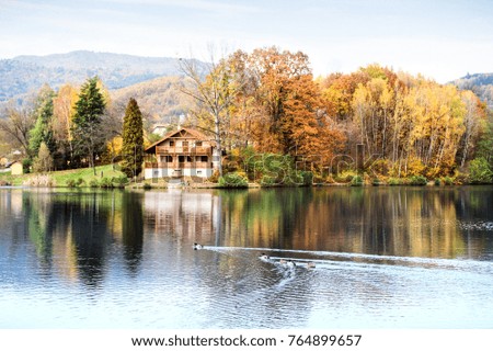 Similar – Image, Stock Photo sun-yellow houses are reflected in a stream…