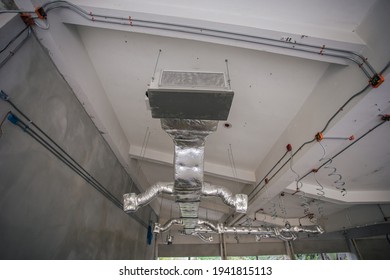 Ducting Work For Air Conditioner Ceiling Type. Installation AC Ductwork In The Construction Site.