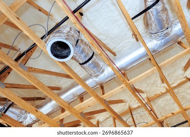 Ductwork insulation are being installed on ceiling in residential renovation project