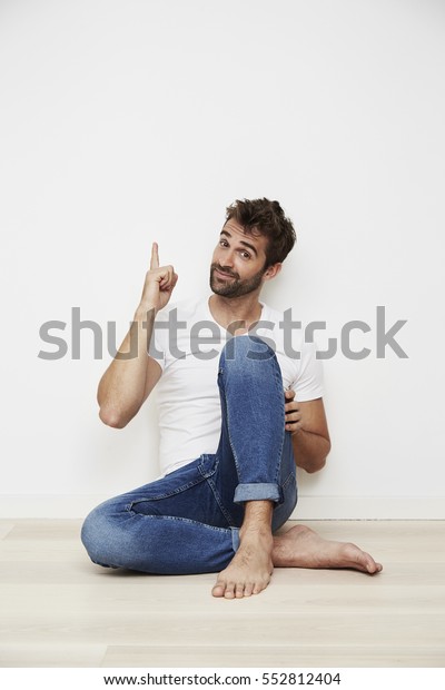 Dude Sitting On Floor Pointing Portrait Stock Photo 552812404 ...