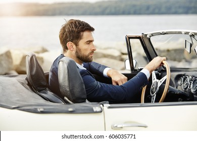 Dude In Sports Car Wearing Suit