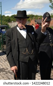 Dudley, West Midlands, England. July 7th 2015.Black Country Museum World War 2 Theme Day. Man Posing As Winston Churchill Giving Famous V For Victory Sign.